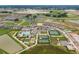 Aerial view of community with various amenities, including pool and tennis courts at 31396 Cabana Rye Ave, San Antonio, FL 33576