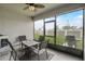 Cozy screened patio with seating for outdoor dining at 31396 Cabana Rye Ave, San Antonio, FL 33576