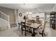 Dining area with dark wood table and chairs, near kitchen at 31396 Cabana Rye Ave, San Antonio, FL 33576