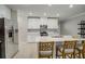 Modern kitchen with white cabinets and stainless steel appliances at 31396 Cabana Rye Ave, San Antonio, FL 33576