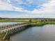 Aerial view of a wooden bridge over a lake in a community at 31396 Cabana Rye Ave, San Antonio, FL 33576