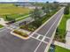 Gated entrance to a new community with landscaped medians and signage at 31396 Cabana Rye Ave, San Antonio, FL 33576