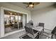 Outdoor patio with seating area, ceiling fan, and view of the backyard at 31396 Cabana Rye Ave, San Antonio, FL 33576