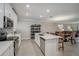 Modern kitchen with white cabinets, stainless steel appliances, and an island at 31396 Cabana Rye Ave, San Antonio, FL 33576