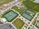 Aerial view of community tennis courts and surrounding green spaces at 31396 Cabana Rye Ave, San Antonio, FL 33576