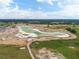 Aerial view of a lagoon under construction within a community at 31396 Cabana Rye Ave, San Antonio, FL 33576