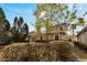 Landscaped backyard with mature trees and hedges at 20026 Heritage Point Dr, Tampa, FL 33647