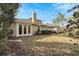 Large backyard with grassy area and some landscaping at 20026 Heritage Point Dr, Tampa, FL 33647