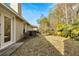 Private backyard with grassy area and hedges at 20026 Heritage Point Dr, Tampa, FL 33647