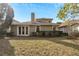 Spacious backyard with grassy area and mature trees at 20026 Heritage Point Dr, Tampa, FL 33647