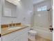 Clean bathroom with tub, shower, and granite countertop at 20026 Heritage Point Dr, Tampa, FL 33647
