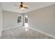 Bright bedroom featuring a ceiling fan and ample natural light at 20026 Heritage Point Dr, Tampa, FL 33647