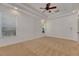 Bright bedroom with carpet, ceiling fan, and window with blinds at 20026 Heritage Point Dr, Tampa, FL 33647