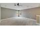 Spacious bedroom with ceiling fan and large windows at 20026 Heritage Point Dr, Tampa, FL 33647