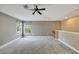 Spacious bedroom with ceiling fan and large windows at 20026 Heritage Point Dr, Tampa, FL 33647