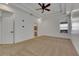 Spacious bedroom with carpeting, ceiling fan, and en-suite bathroom access at 20026 Heritage Point Dr, Tampa, FL 33647
