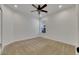 Bright bedroom with ceiling fan and neutral carpeting at 20026 Heritage Point Dr, Tampa, FL 33647