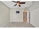Well-lit bedroom, featuring ceiling fan and access to bathroom at 20026 Heritage Point Dr, Tampa, FL 33647