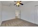 Spacious bedroom with ceiling fan and access to another room at 20026 Heritage Point Dr, Tampa, FL 33647