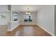Bright dining room featuring hardwood floors and a stylish chandelier at 20026 Heritage Point Dr, Tampa, FL 33647