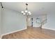 Elegant dining room featuring hardwood floors and chandelier at 20026 Heritage Point Dr, Tampa, FL 33647