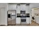 Updated kitchen with stainless steel appliances and granite countertops at 20026 Heritage Point Dr, Tampa, FL 33647