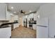 Modern kitchen with white cabinets, stainless steel appliances, and granite countertops at 20026 Heritage Point Dr, Tampa, FL 33647