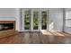 Living area with hardwood floors and access to the backyard through French doors at 20026 Heritage Point Dr, Tampa, FL 33647