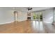 Bright living room with hardwood floors, fireplace, and access to backyard at 20026 Heritage Point Dr, Tampa, FL 33647