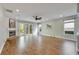 Large living room with hardwood floors, fireplace, and access to backyard at 20026 Heritage Point Dr, Tampa, FL 33647