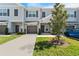 Modern two-story townhouse with gray siding and landscaping at 9658 Sweetwell Pl, Riverview, FL 33569