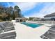 Relaxing community pool with lounge chairs and cabana at 9658 Sweetwell Pl, Riverview, FL 33569