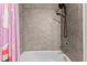 Bathroom with shower, bathtub, and gray tile at 9658 Sweetwell Pl, Riverview, FL 33569