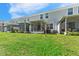 A spacious backyard with lush green grass and private patios for outdoor enjoyment at 9658 Sweetwell Pl, Riverview, FL 33569