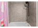 Bathroom featuring tile surround bathtub and shower with modern fixtures at 9658 Sweetwell Pl, Riverview, FL 33569
