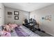 Comfortable bedroom featuring desk and workstation at 9658 Sweetwell Pl, Riverview, FL 33569