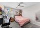 Cozy bedroom with ceiling fan, plush carpet and study space at 9658 Sweetwell Pl, Riverview, FL 33569
