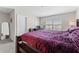 Comfortable bedroom with a plush bed, carpeted floors, and natural light from the window at 9658 Sweetwell Pl, Riverview, FL 33569