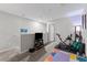 Carpeted bonus room featuring space for fitness and entertainment at 9658 Sweetwell Pl, Riverview, FL 33569