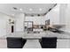 Bright kitchen features granite countertops, stainless steel appliances, and a breakfast bar with seating at 9658 Sweetwell Pl, Riverview, FL 33569