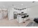 Bright kitchen features stainless appliances, granite counters and breakfast bar with barstool seating at 9658 Sweetwell Pl, Riverview, FL 33569