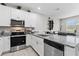 Well-appointed kitchen with granite counters, stainless steel appliances, and ample cabinet space at 9658 Sweetwell Pl, Riverview, FL 33569