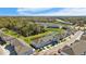 Aerial view of townhouses, pond, and surrounding area at 9658 Sweetwell Pl, Riverview, FL 33569