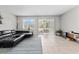 Bright living room with large windows and access to a back patio at 9658 Sweetwell Pl, Riverview, FL 33569