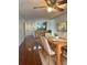 Dining room with hardwood floors, large table, and view into kitchen at 4115 Chatham Oak Ct # 218, Tampa, FL 33624