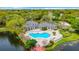 Community pool and clubhouse near a lake at 4115 Chatham Oak Ct # 218, Tampa, FL 33624