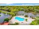 Community pool and clubhouse with surrounding landscaping at 4115 Chatham Oak Ct # 218, Tampa, FL 33624