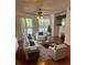 Spacious living room with hardwood floors, comfy furniture, and large TV at 4115 Chatham Oak Ct # 218, Tampa, FL 33624