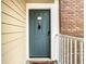 Private condo entry with gray door and white railing at 4115 Chatham Oak Ct # 218, Tampa, FL 33624
