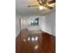 Spacious living room with hardwood floors and a view into the kitchen at 4115 Chatham Oak Ct # 218, Tampa, FL 33624